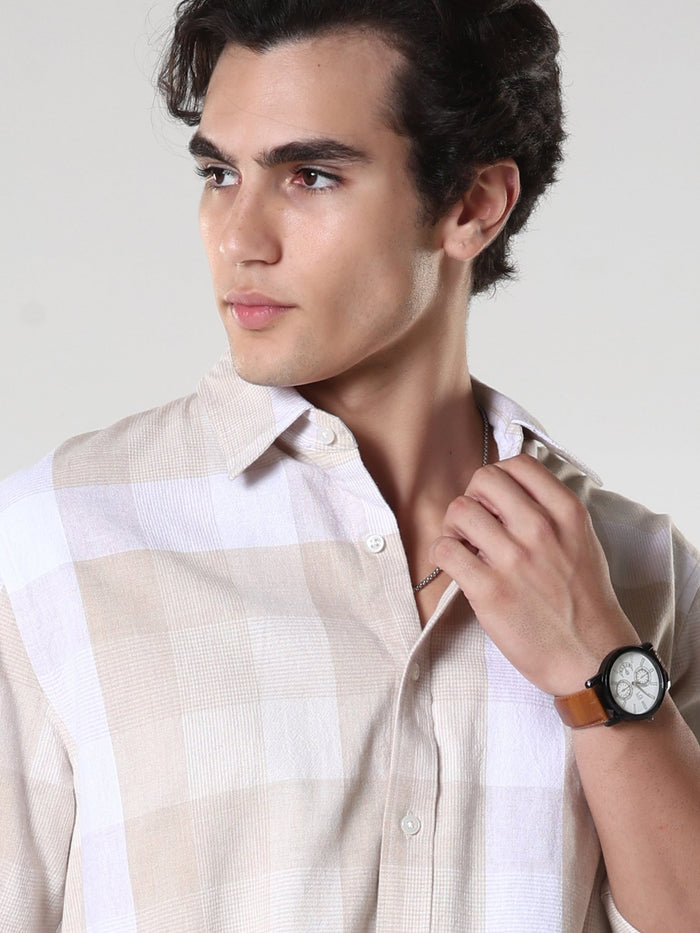 Men's casual beige checkered cotton shirt with full sleeves, relaxed fit – paired with denim jeans