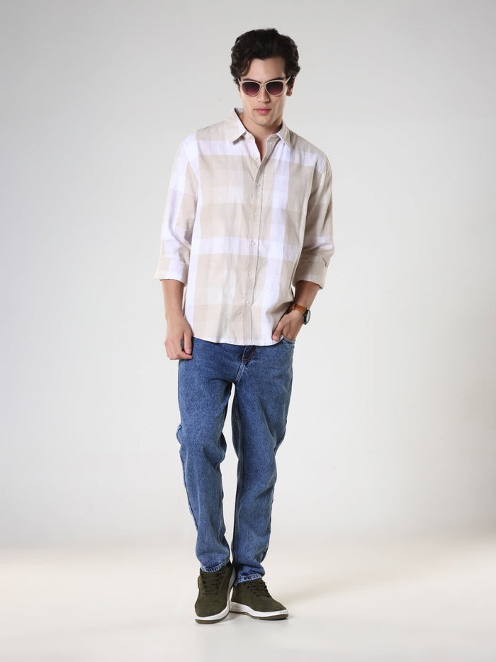 Men's casual beige checkered cotton shirt with full sleeves, relaxed fit – paired with denim jeans