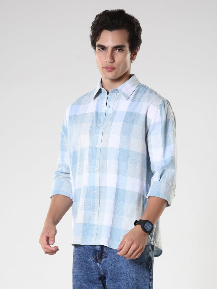 Men's casual sky blue checkered cotton shirt with full sleeves, relaxed fit – paired with denim jeans