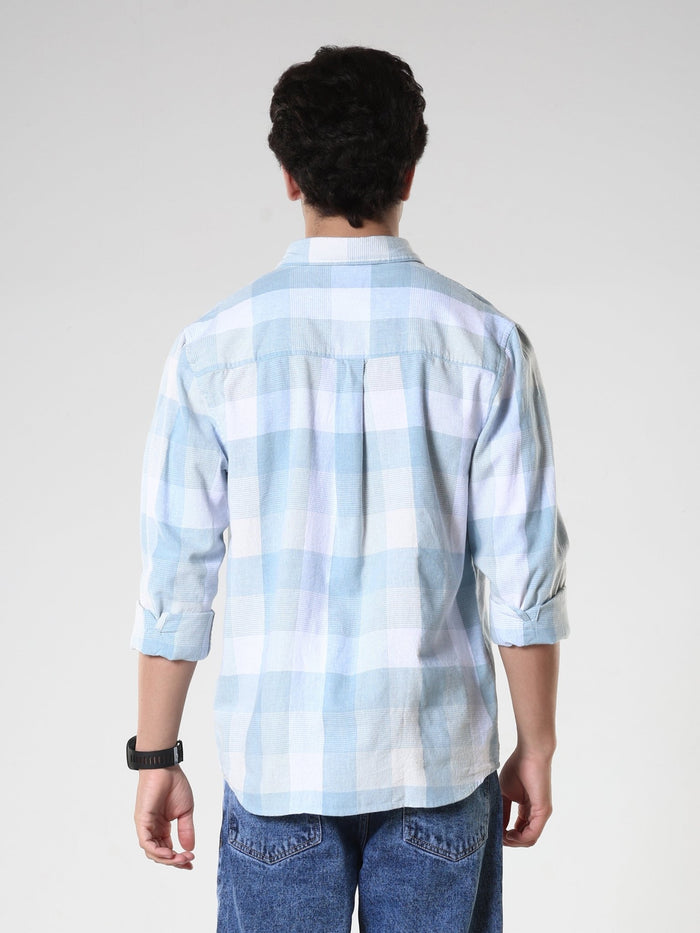 Men's casual sky blue checkered cotton shirt with full sleeves, relaxed fit – paired with denim jeans