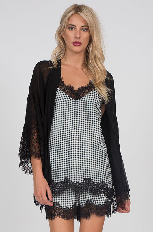 Model is wearing the Anne Marie Silk Cami in black/off white with the Coco Silk Lace Kimono in black and Anne Marie shorts in black/off white.