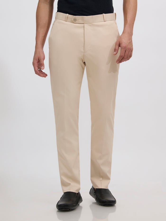 men's sand beige skinny fit trousers blended with polyster and spandex - paired with a black top and black shoes