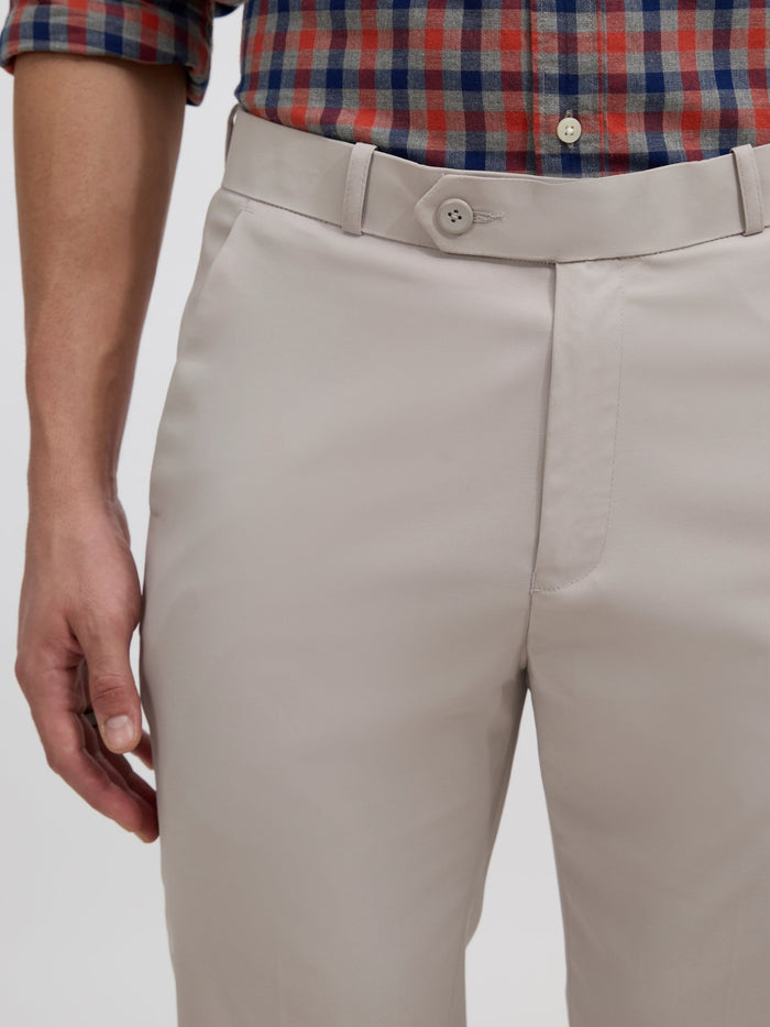 men's sand gray skinny fit trousers blended with polyster and spandex - paired with a black top and black shoes