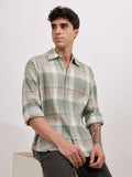 Men's oversized green checkered cotton shirt with full sleeves, styled with black jeans – casual fashion look