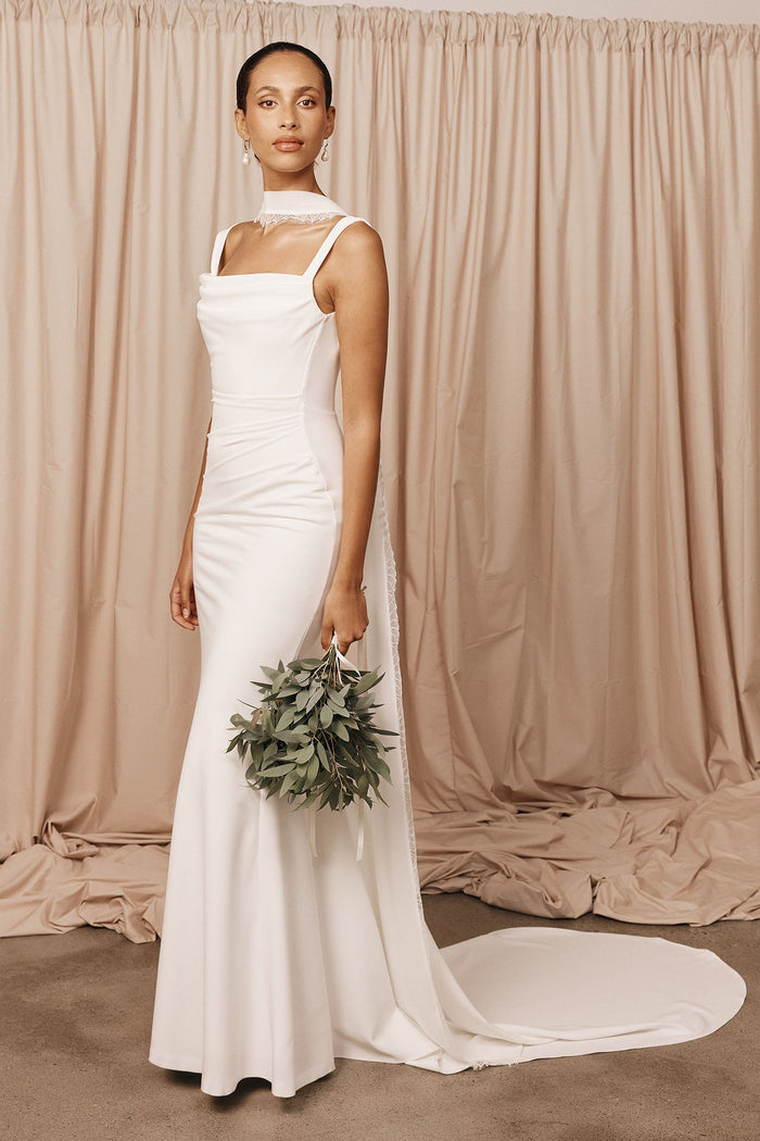 Model wearing a bridal neckscarf and wedding dress