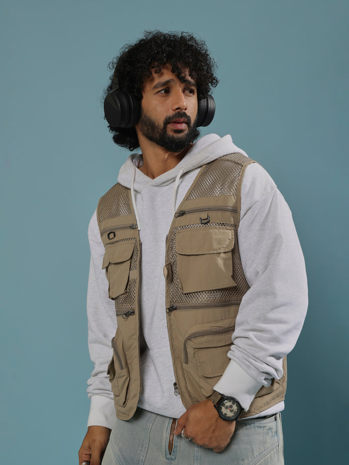 men's biege zippered cargo vest with utility pockets and zip closure
trendy outfits for men