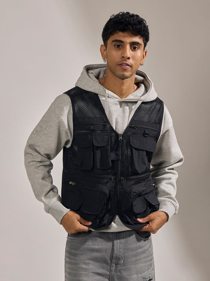 men's black zippered cargo vest with utility pockets and zip closure
trendy outfits for men