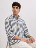 Man wearing a monochrome cotton oversized striped shirt with rolled sleeves, front pocket, and button-down collar
100% cotton