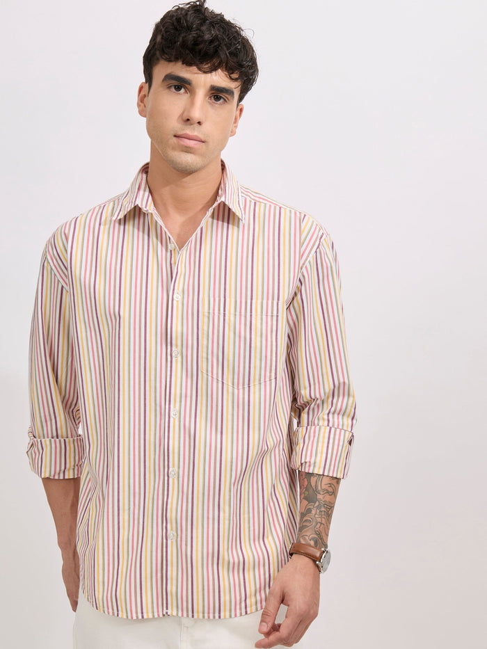 Man wearing a peach cotton oversized striped shirt with rolled sleeves, front pocket, and button-down collar
100% cotton